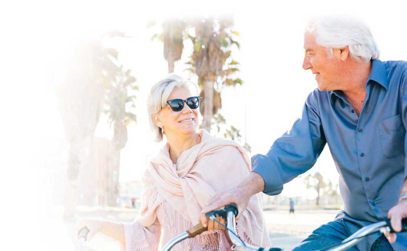 Older couple enjoying a bike ride